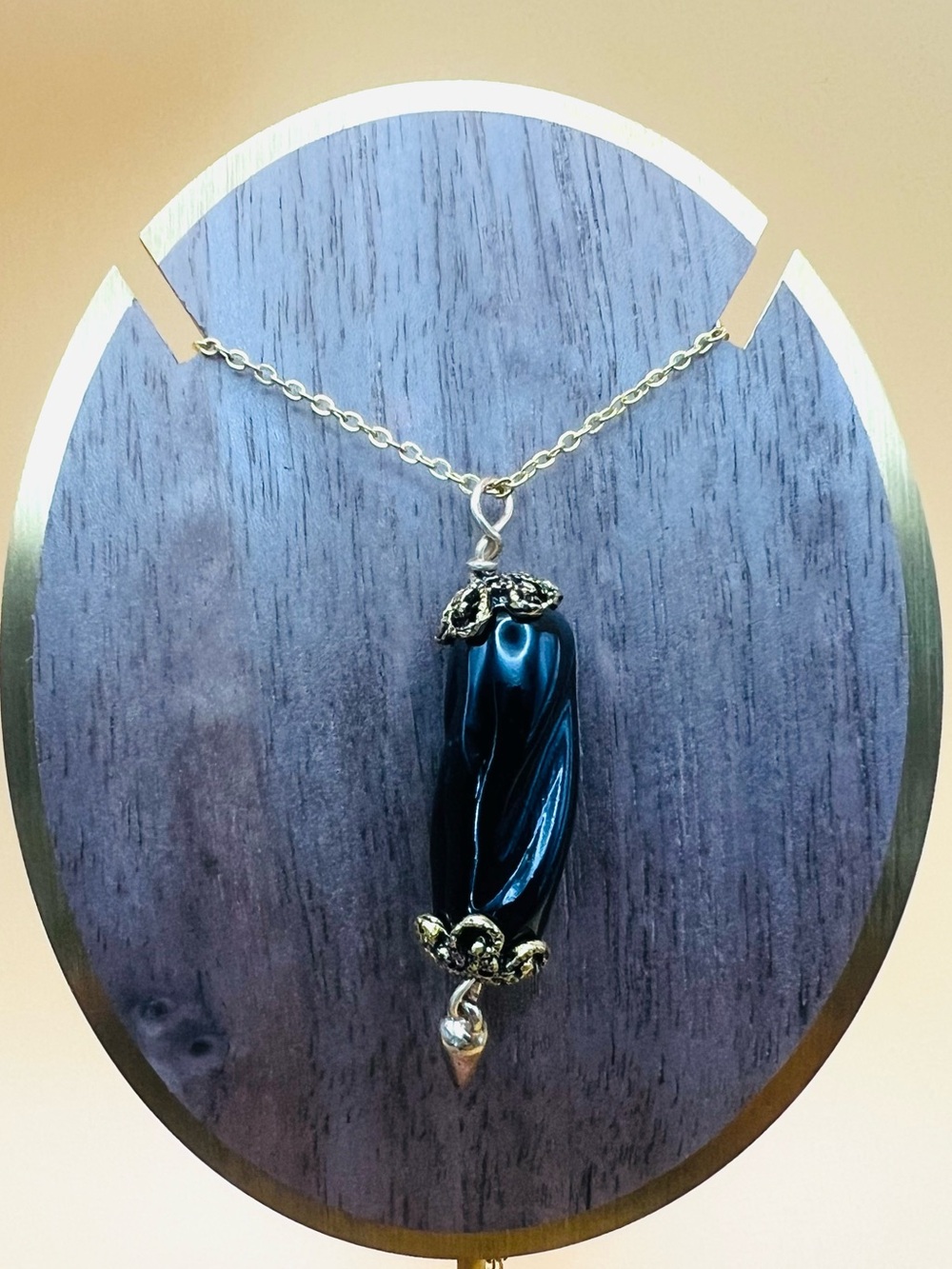 Elegant Black Glass Pendant Necklace with Gold Accents